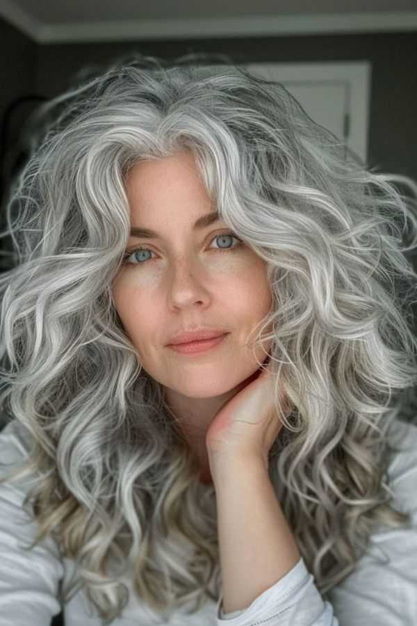 Voluminous Curls with Silver Blonde Tones